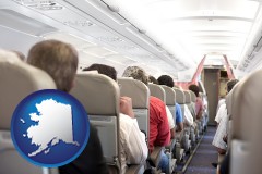 alaska map icon and airline passengers in a commercial jetliner
