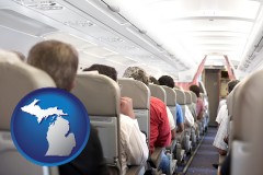 michigan map icon and airline passengers in a commercial jetliner
